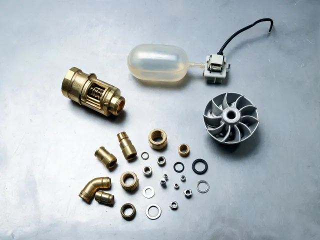 Pump check valves and float switches on bench